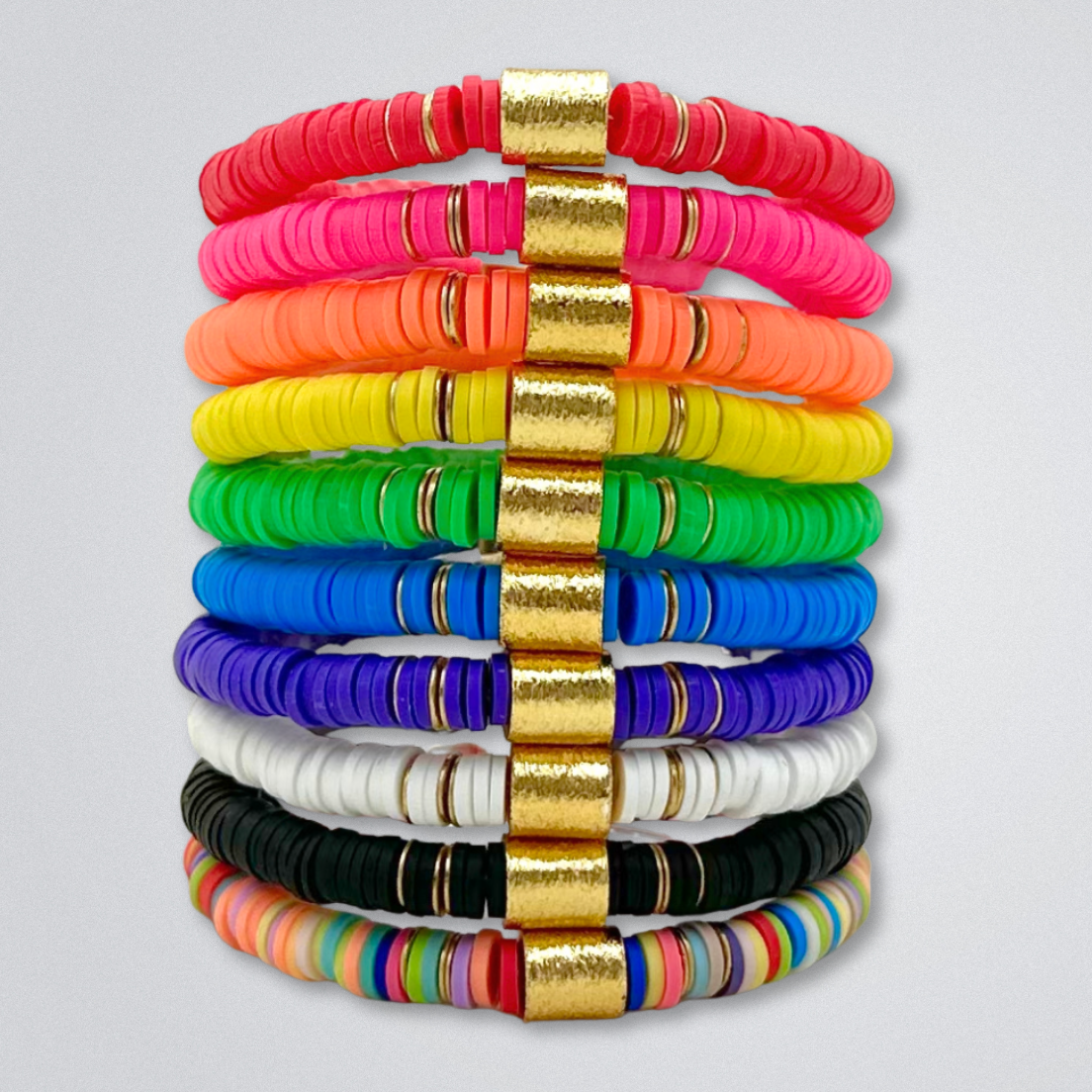 Broadway Stacks rainbow colors elastic stretch bracelets with gold color accents. Star logo bead to remind you that You Shine. Available in red pink orange yellow green blue purple white black and mulit-color. TKTS Steps.