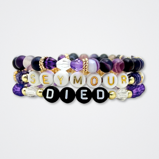 Broadway Stacks QUEEN collection. Stretch bracelets included in Stack. Gold, yellow, green, white, red, pink and blue colored beads. Letter beads that spell each queen. Also Herstory collection. Broadway Stacks gold star logo bead to remind you that You Shine. SIX the Musical fans.