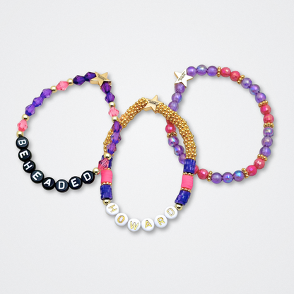 Broadway Stacks QUEEN collection. Stretch bracelets included in Stack. Gold, yellow, green, white, red, pink and blue colored beads. Letter beads that spell each queen. Also Herstory collection. Broadway Stacks gold star logo bead to remind you that You Shine. SIX the Musical fans.