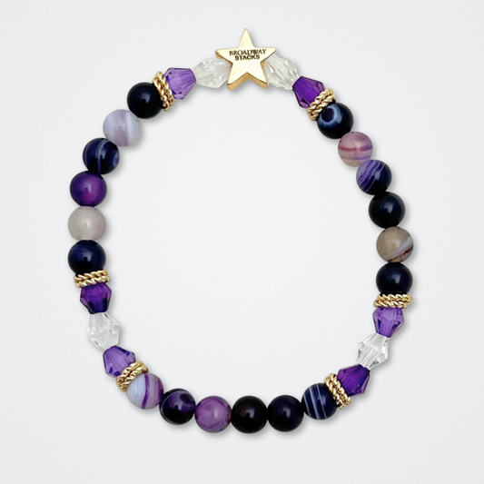 Broadway Stacks QUEEN collection. Stretch bracelets included in Stack. Gold, yellow, green, white, red, pink and blue colored beads. Letter beads that spell each queen. Also Herstory collection. Broadway Stacks gold star logo bead to remind you that You Shine. SIX the Musical fans.