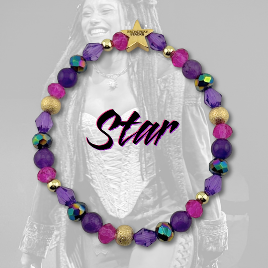 Variety of purple and pink beads on bracelet on a black & white background of the character STAR from The Lost Boys Musical. Broadway Stacks VAMPIRE Collection. Gold star logo bead to remind you that you shine. 