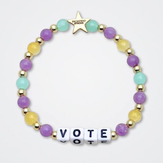Broadway Stacks CAMPAIGN Collection. 5 stretch bracelets included in Stack. Purple, yellow, teal and gold colored beads. Letter beads that spell quotes. Gold star logo bead to remind you that you shine. Suffs fans. 