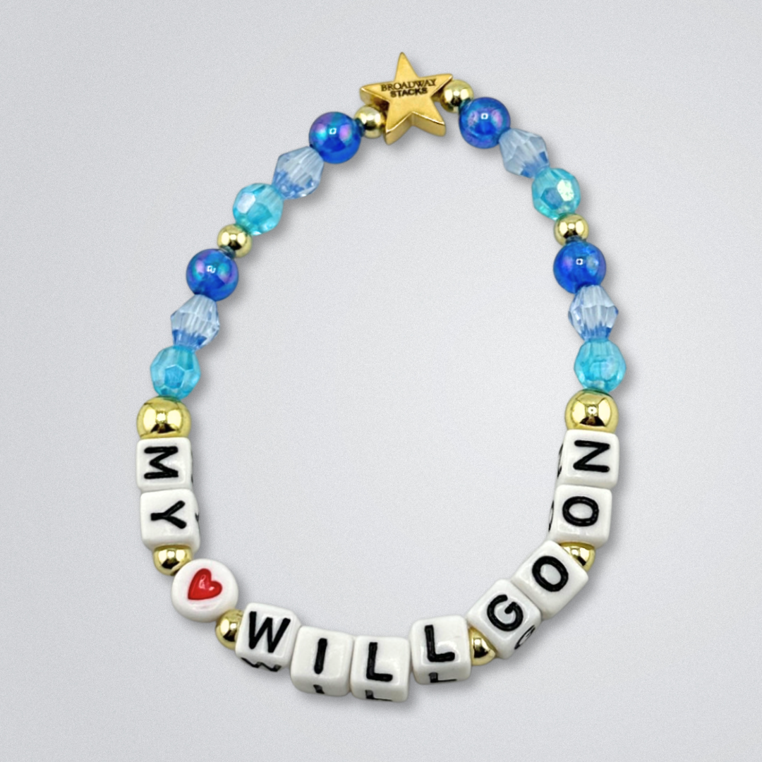 Bead bracelet with letter beads spelling 'MY <3 WILL GO ON' on a gray background. Broadway Stacks UNSINKABLE Collection. Blues and gold colored beads. Gold star logo bead to remind you that you shine. Inspired by Titanique the Musical.