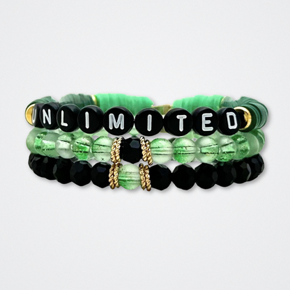 Broadway Stacks WITCH collection. 3 stretch bracelets included in Stack. Greens, pinks, black and gold colored beads. Letter beads that spell quotes. Gold star logo bead to remind you that You Shine. Wicked fans.