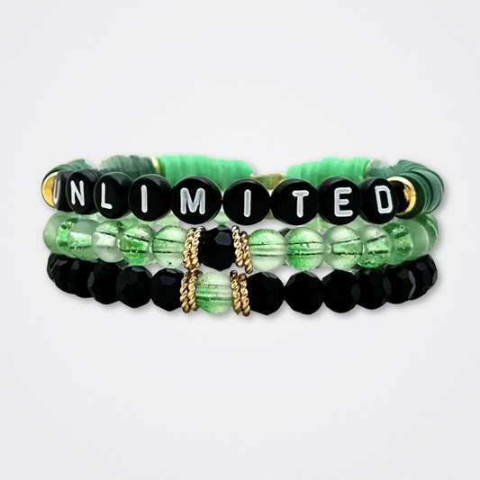 Broadway Stacks WITCH collection. 3 stretch bracelets included in Stack. Greens, pinks, black and gold colored beads. Letter beads that spell quotes. Gold star logo bead to remind you that You Shine. Wicked fans.