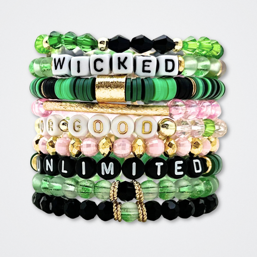 Broadway Stacks WITCH collection. 3 stretch bracelets included in Stack. Greens, pinks, black and gold colored beads. Letter beads that spell quotes. Gold star logo bead to remind you that You Shine. Wicked fans.