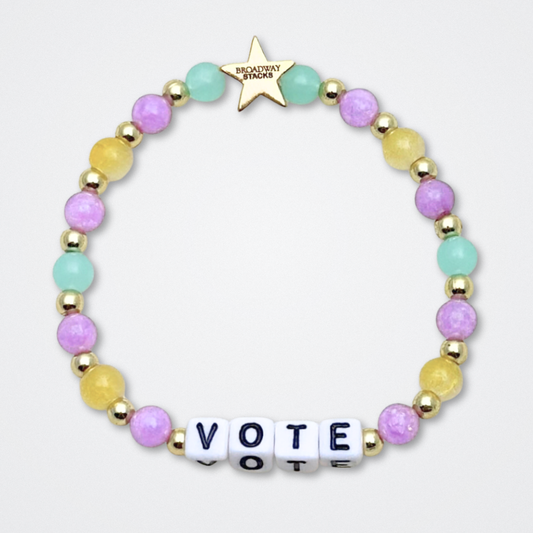 Broadway Stacks CAMPAIGN Collection. 5 stretch bracelets included in Stack. Purple, yellow, teal and gold colored beads. Letter beads that spell quotes. Gold star logo bead to remind you that you shine. Suffs fans. 