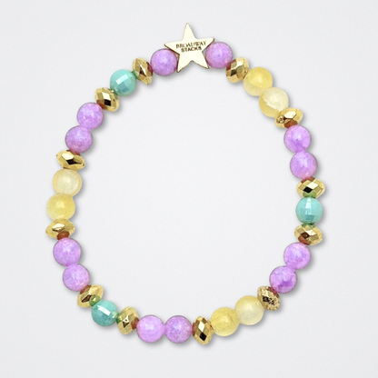 Broadway Stacks CAMPAIGN Collection. 5 stretch bracelets included in Stack. Purple, yellow, teal and gold colored beads. Letter beads that spell quotes. Gold star logo bead to remind you that you shine. Suffs fans. 
