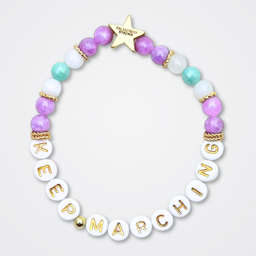 Broadway Stacks CAMPAIGN Collection. 5 stretch bracelets included in Stack. Purple, yellow, teal and gold colored beads. Letter beads that spell quotes. Gold star logo bead to remind you that you shine. Suffs fans. 