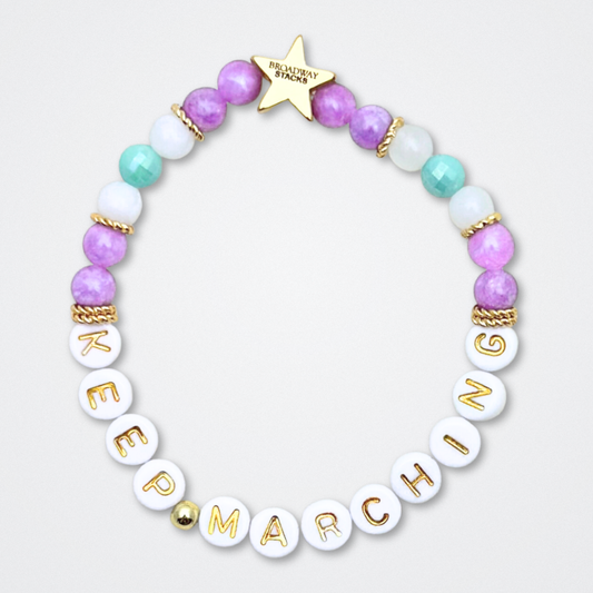 Broadway Stacks CAMPAIGN Collection. 5 stretch bracelets included in Stack. Purple, yellow, teal and gold colored beads. Letter beads that spell quotes. Gold star logo bead to remind you that you shine. Suffs fans. 