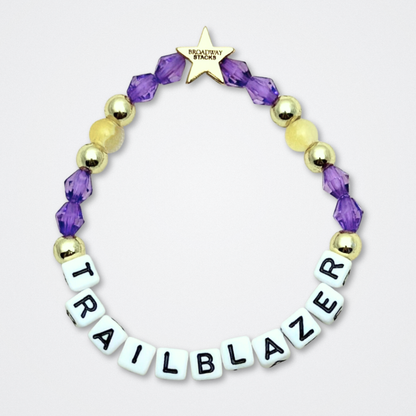 Broadway Stacks CAMPAIGN Collection. 5 stretch bracelets included in Stack. Purple, yellow, teal and gold colored beads. Letter beads that spell quotes. Gold star logo bead to remind you that you shine. Suffs fans. 