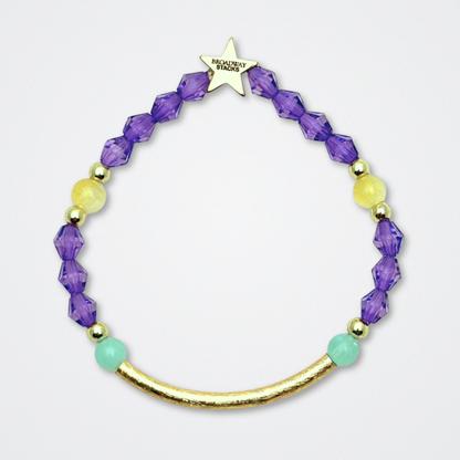 Broadway Stacks CAMPAIGN Collection. 5 stretch bracelets included in Stack. Purple, yellow, teal and gold colored beads. Letter beads that spell quotes. Gold star logo bead to remind you that you shine. Suffs fans. 