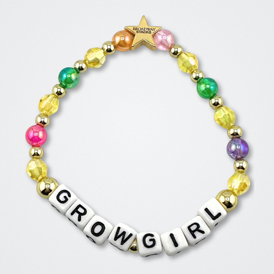 Broadway Stacks GARDEN bracelet with yellow, green, purple, pink, orange and gold color beads. Letters say GROW GIRL. Displayed on a gray background.