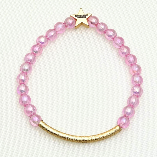 Broadway Stacks Witch collection. 3 stretch bracelets included in Stack. Greens, pinks, black and gold colored beads. Letter beads that spell Wicked. Gold star logo bead on every bracelet. 