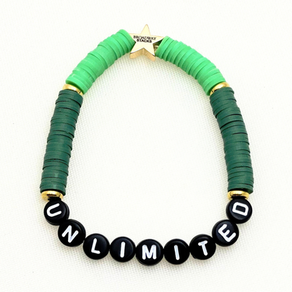 Broadway Stacks Witch collection. 3 stretch bracelets included in Stack. Greens, pinks, black and gold colored beads. Letter beads that spell Wicked. Gold star logo bead on every bracelet. 