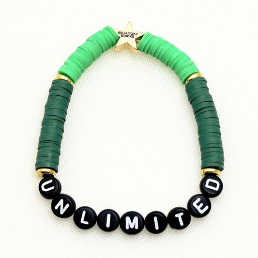 Broadway Stacks Witch collection. 3 stretch bracelets included in Stack. Greens, pinks, black and gold colored beads. Letter beads that spell Wicked. Gold star logo bead on every bracelet. 