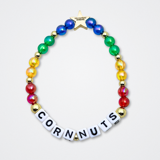 Broadway Stacks CORN NUTS Collection. 5 stretch bracelets included in Stack. Red, yellow, green, blue, black and gold colored beads. Letter beads that spell quotes. Gold star logo bead to remind you that you shine. Heathers the Musical fans.